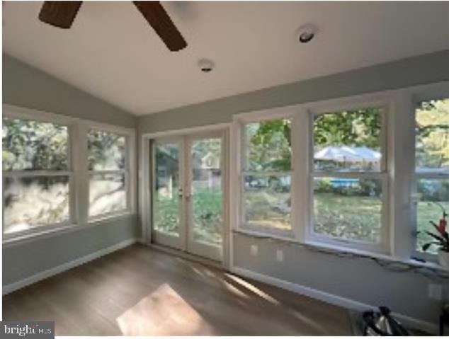 unfurnished sunroom with french doors, vaulted ceiling, and ceiling fan