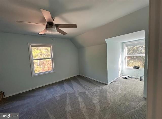 additional living space featuring lofted ceiling, ceiling fan, carpet, and a wealth of natural light