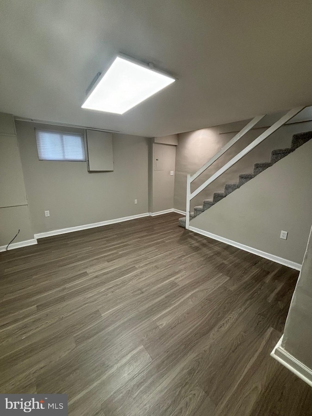 basement featuring dark wood-type flooring