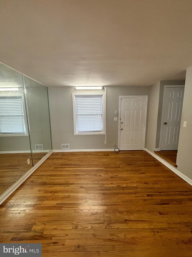 interior space with hardwood / wood-style flooring and a wealth of natural light