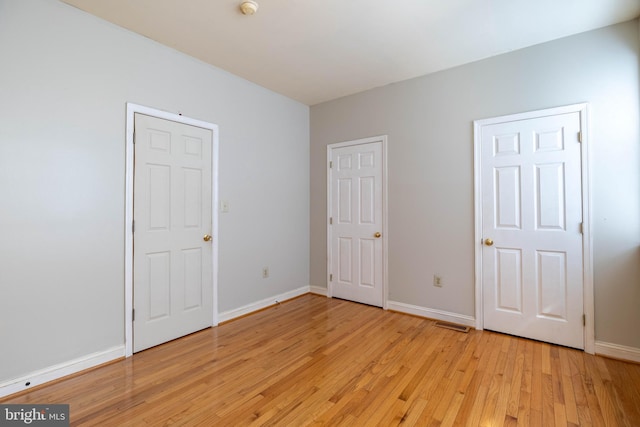 unfurnished bedroom featuring light hardwood / wood-style flooring