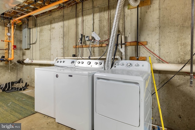 clothes washing area featuring washer and dryer