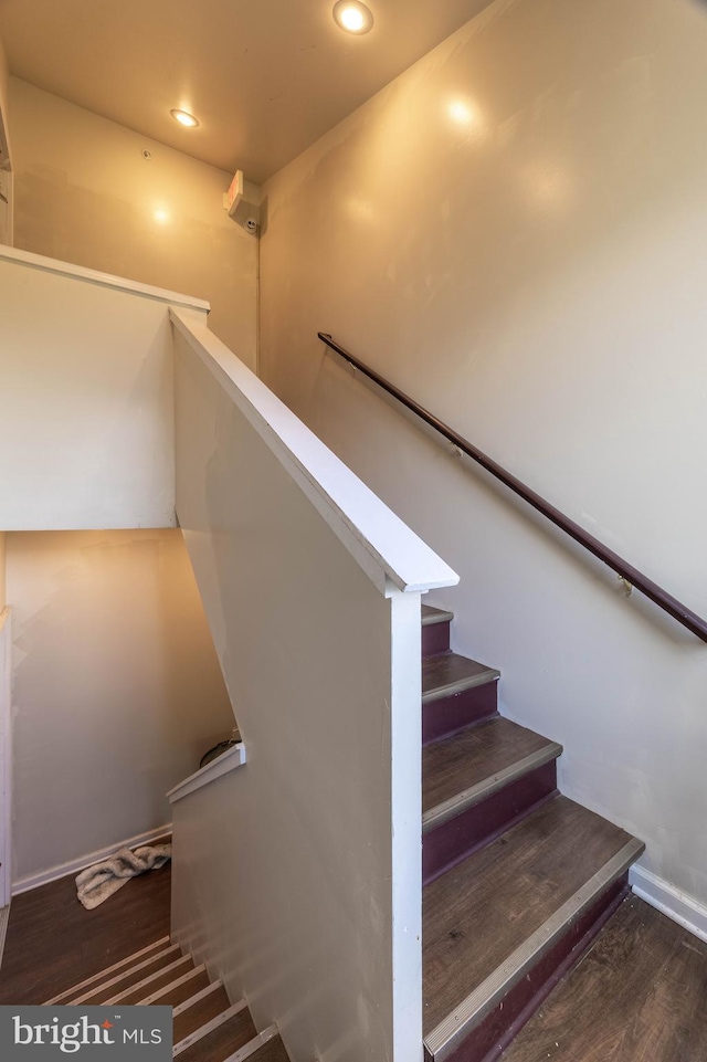 staircase featuring hardwood / wood-style floors