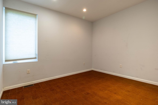 empty room featuring hardwood / wood-style floors