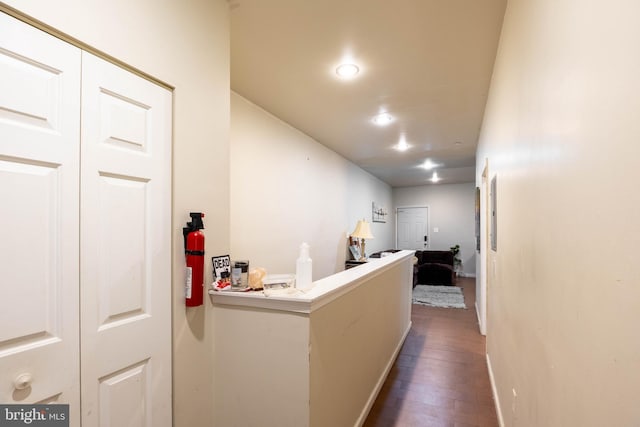 hall with dark hardwood / wood-style flooring