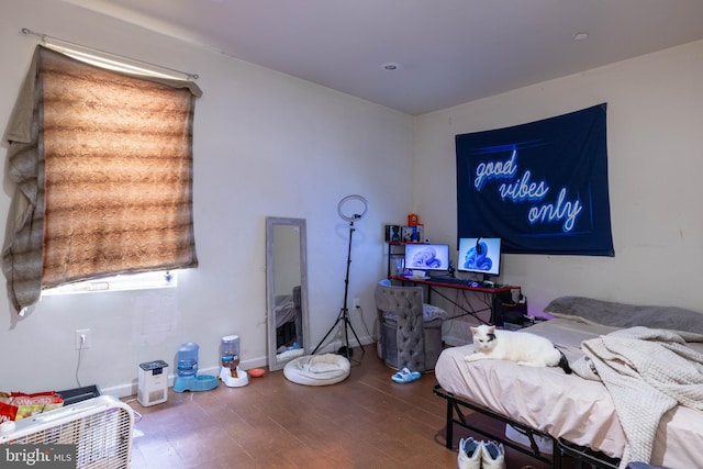 bedroom with wood-type flooring