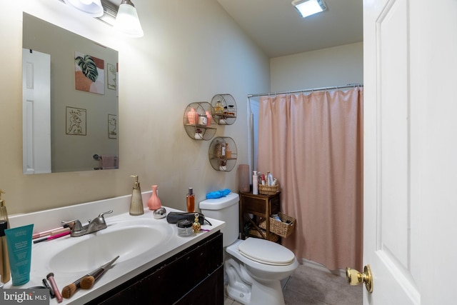 bathroom featuring vanity, a shower with shower curtain, toilet, and tile patterned flooring