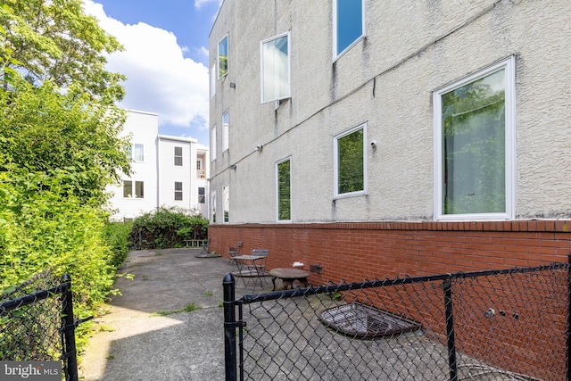 view of side of home featuring a patio area