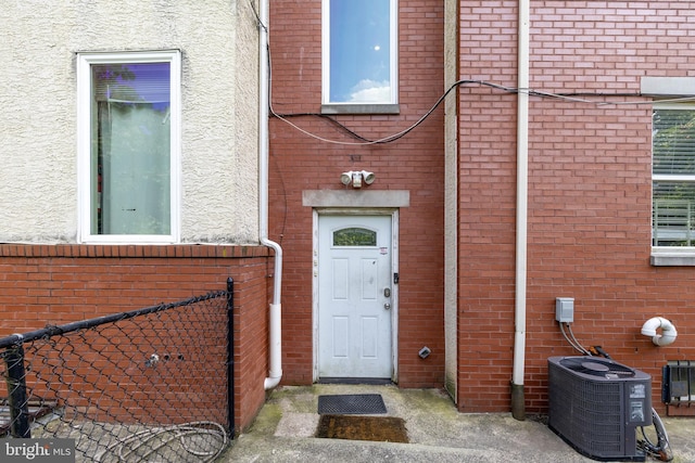 doorway to property with central air condition unit