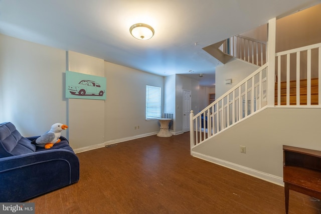 living room featuring dark hardwood / wood-style floors