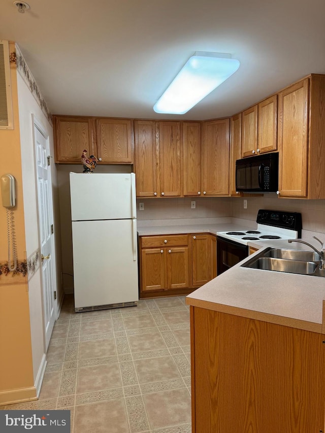 kitchen with sink and white appliances