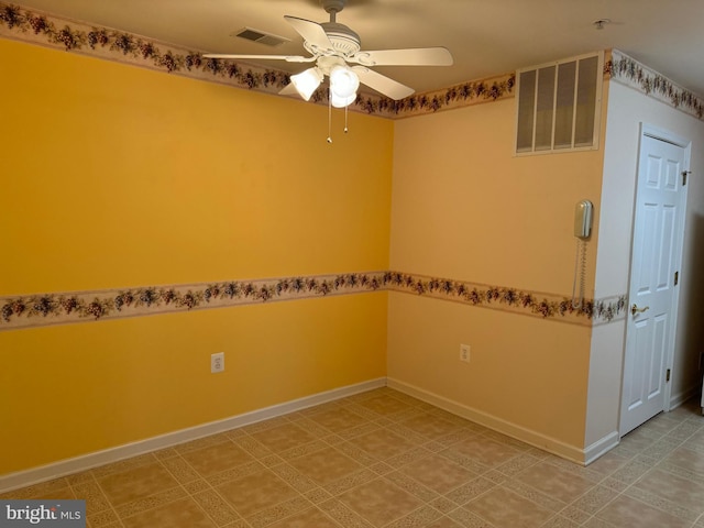 unfurnished room with ceiling fan