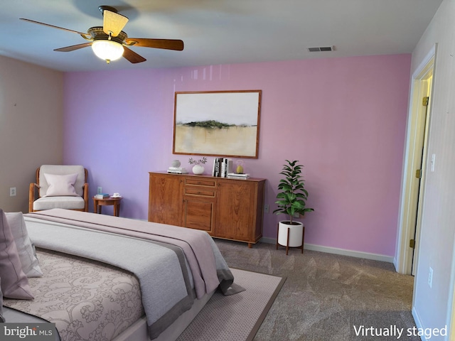 bedroom with dark carpet and ceiling fan