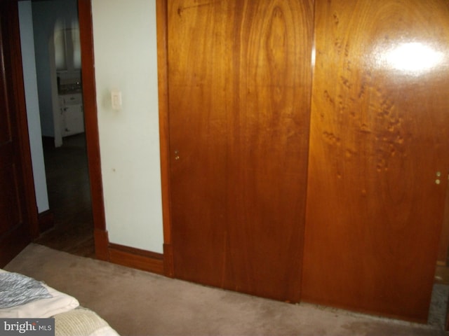 bedroom featuring dark carpet