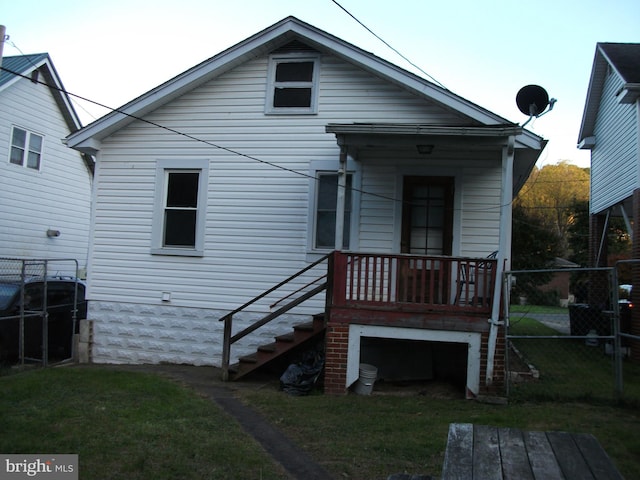 rear view of house with a lawn