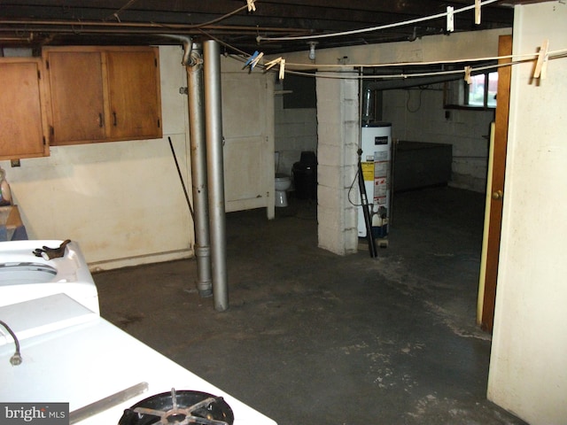 basement with independent washer and dryer and gas water heater