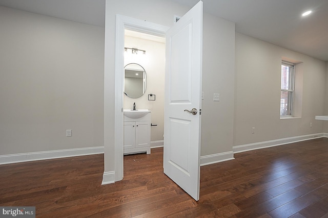 bathroom with vanity and hardwood / wood-style floors