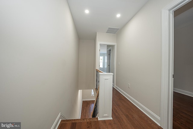 corridor featuring dark wood-type flooring