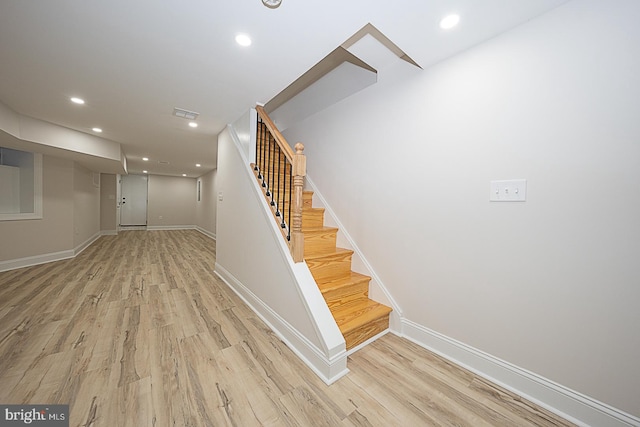 stairway with wood-type flooring