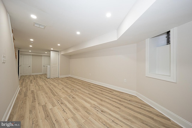 basement featuring light wood-type flooring