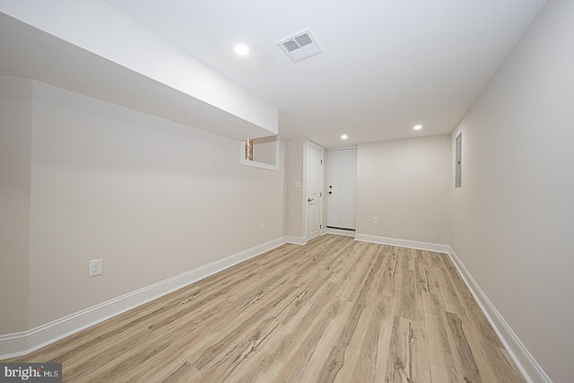 basement featuring light hardwood / wood-style flooring