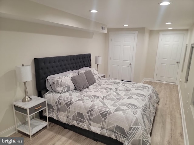 bedroom featuring hardwood / wood-style flooring