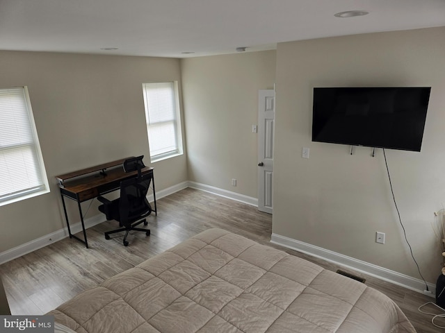 bedroom featuring light wood-type flooring