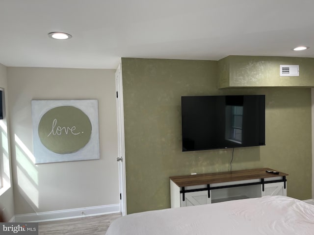 bedroom featuring wood-type flooring