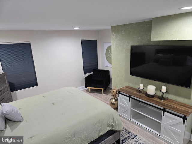 bedroom with wood-type flooring