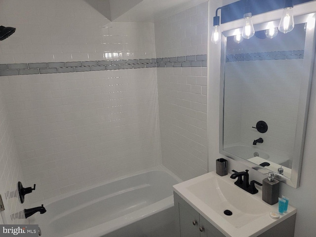 bathroom with vanity and tiled shower / bath combo