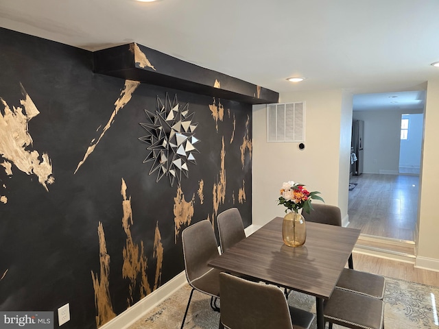 dining area featuring hardwood / wood-style floors