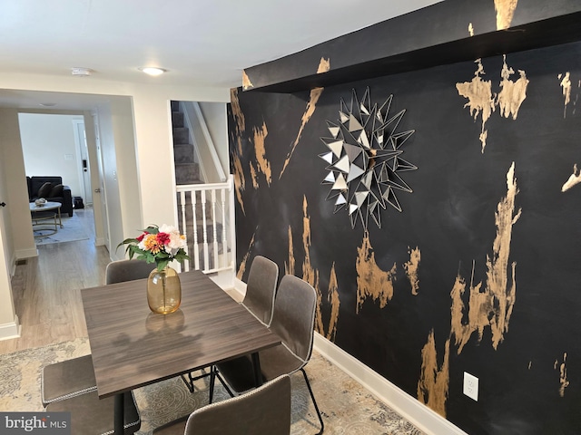 dining area featuring hardwood / wood-style floors