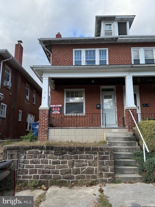 view of front of home featuring covered porch