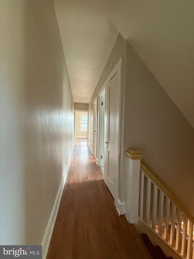 hallway with wood-type flooring