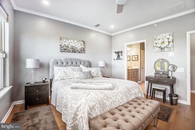 bedroom featuring ceiling fan, ensuite bath, ornamental molding, and hardwood / wood-style floors