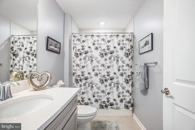 full bathroom with vanity, toilet, tile patterned floors, and shower / tub combo