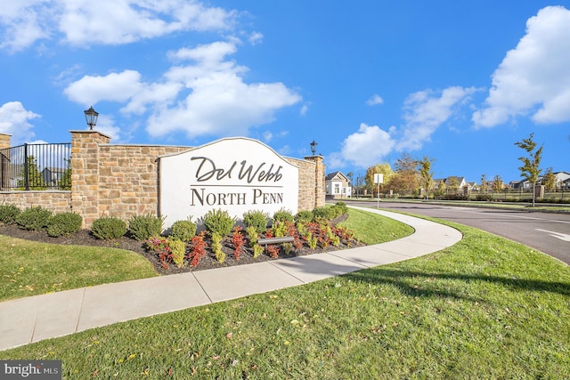 community sign with a lawn