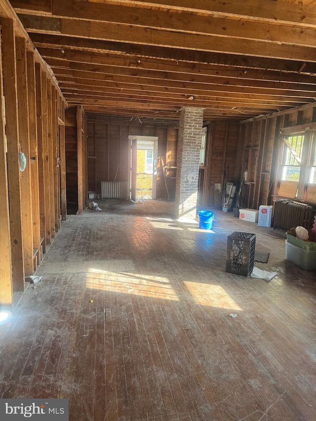 misc room with wood-type flooring and a wealth of natural light