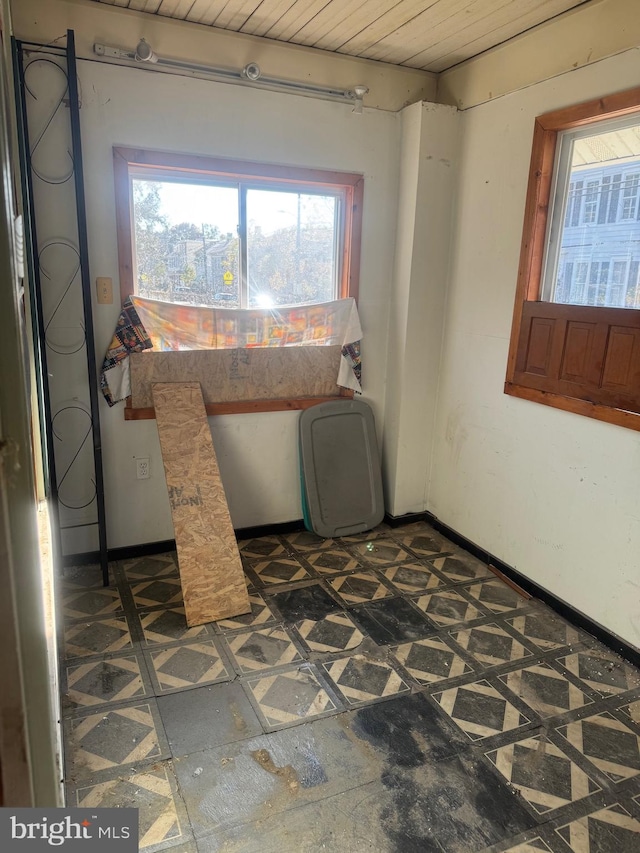 laundry area featuring wooden ceiling