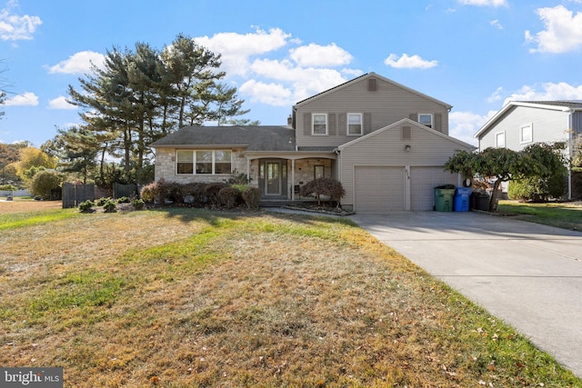 view of front facade with a front yard and a garage