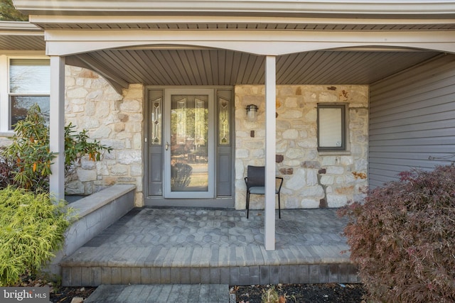 property entrance featuring covered porch