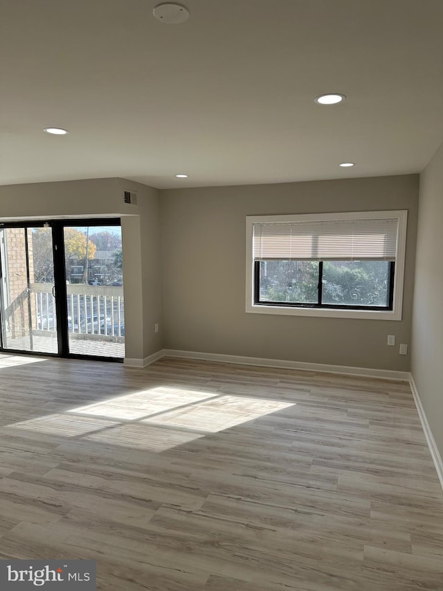 unfurnished room featuring light hardwood / wood-style floors