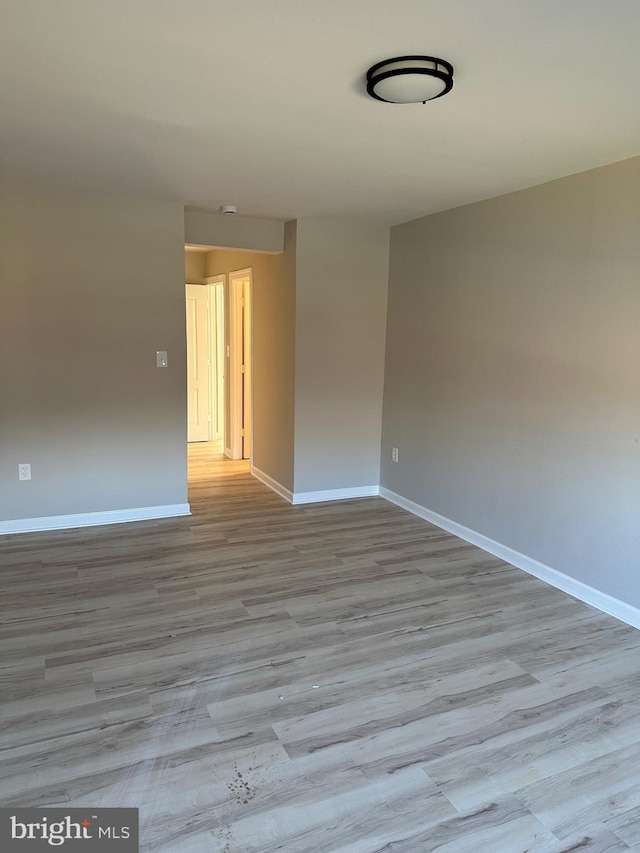 unfurnished room featuring light wood-type flooring