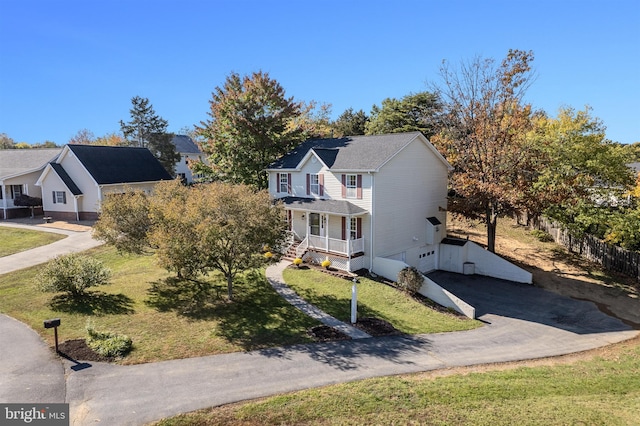 view of front of home featuring a porch and a front lawn