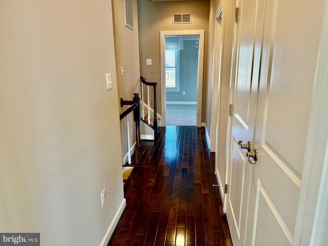 hallway with dark wood-type flooring