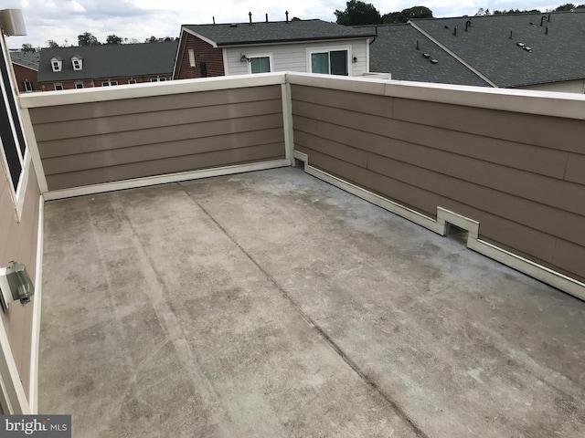 view of patio featuring a balcony