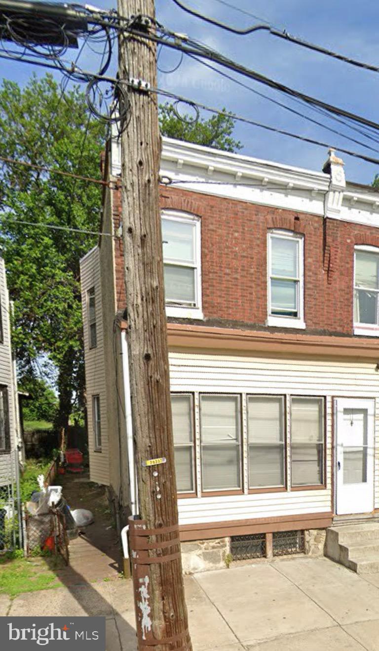 4747 N Marvine St, Philadelphia, PA 19141 - view of front of property with a patio, entry steps, and brick siding