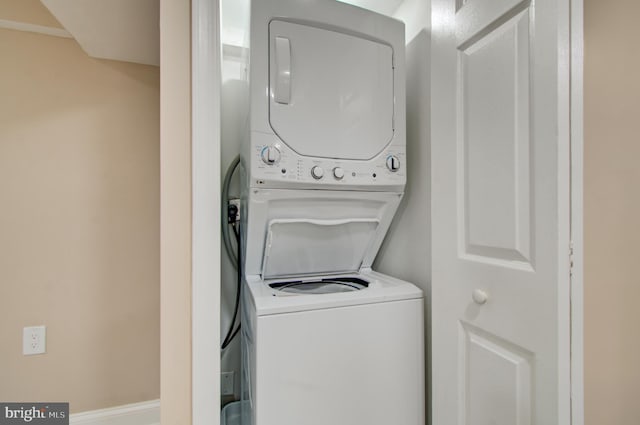 laundry room featuring stacked washer and dryer