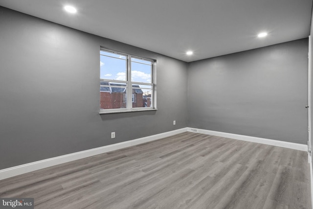 spare room with light wood-type flooring