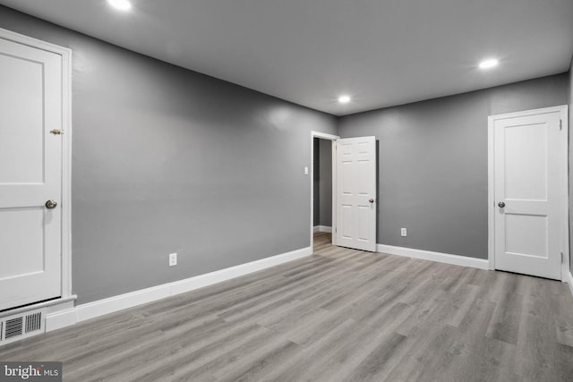 unfurnished room featuring light wood-type flooring